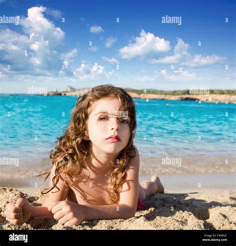 Beautiful Little Girl In Sandy Beach Of Ibiza San Antonio Cala Conta
