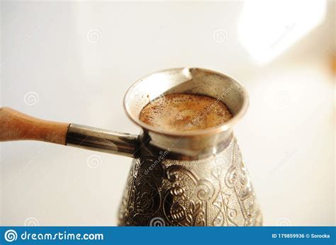 Brewing Turkish Coffee In Cooper Cezve Close Up White Background Stock