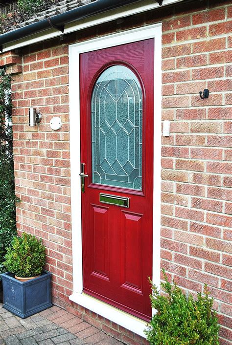 A Bold Statement Red Composite Front Door With Arched Glass Panel