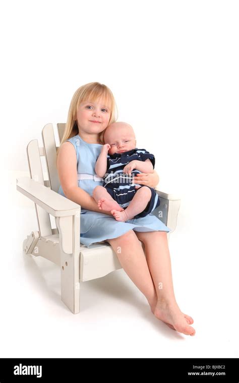 Big Sister Holding Her Newborn Baby Brother On White Stock Photo Alamy