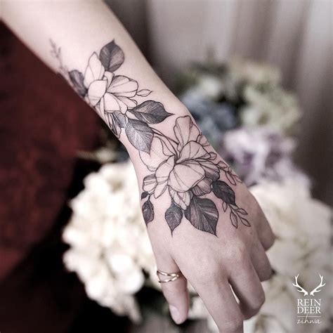 Flower Tattoo On Hand Small Idalias Salon