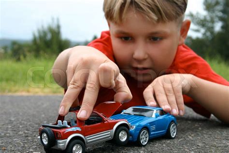 A Boy Playing With Toy Cars Stock Image Colourbox
