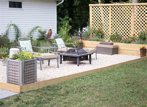 After the patio is firm enough to walk on, spread stone dust over the stones and sweep it into the joints and along the edge. Pea Gravel Patio DIY - Gina Michele