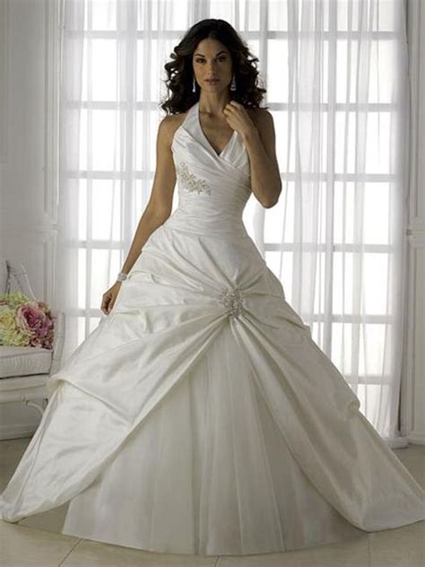 Ball gown bridal dress has a fitted bodice and a full, floor length skirt, and creates a romantic look. Satin Ball Gown Wedding Dress