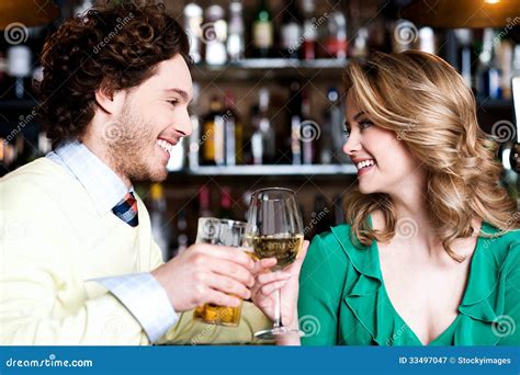 Couples Enjoying Drinks In Nightclub Stock Image Image Of Looking
