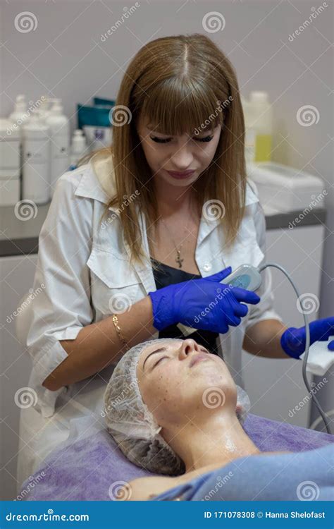 Beautician Makes Facial Massage To A Woman Stock Photo Image Of