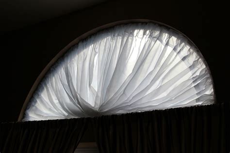 If you aren't concerned with fitting your curtains to the shape of your arched window, covering it is simple! Window coverings diy, Arched window coverings, Arched ...
