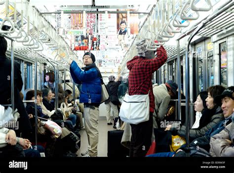 Commuters Inside The Tokyo Metro Subway Tokyo Japan Stock Photo