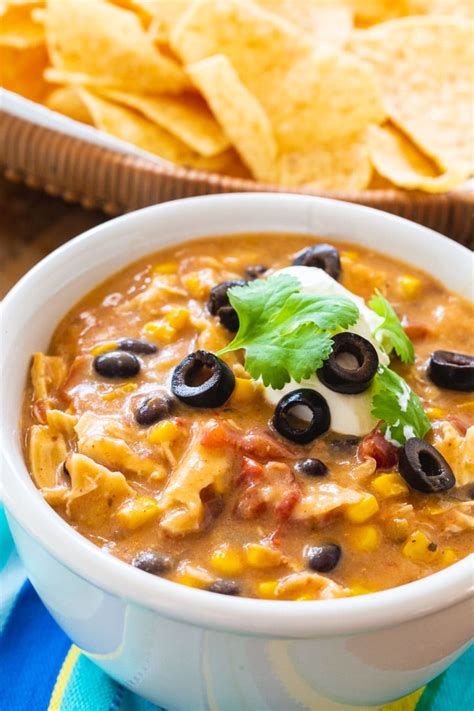 Delicious crockpot chicken tortilla soup is a tasty combination of chicken, beans, tomatoes, and plenty of spices. Slow Cooker Chicken Tortilla Soup - Spicy Southern Kitchen