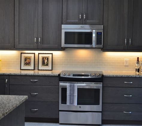 Dark Gray Stained Kitchen Cabinets In 2020 Grey Kitchen Cabinets