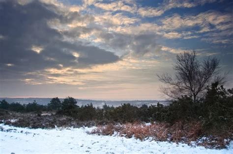 Vibrant Winter Sunrise Landscape Over Snow Covered Countryside Stock