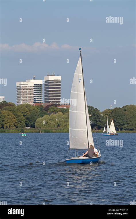 Mundsburg Tower Buildings Sailing Boats On Lake Outer Alster Hamburg