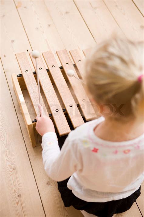 A Young Girl Playing With Xylophone Stock Image Colourbox