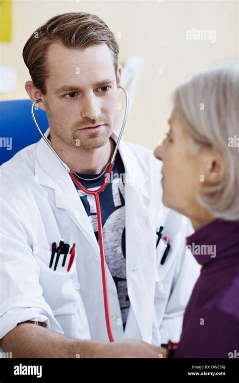 Doctor Listens To Patients Heart Hi Res Stock Photography And Images