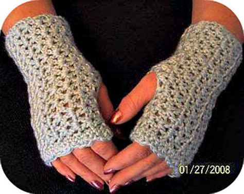 Womans Hands In Crocheted Gloves With Fingers Folded Over Their Palms