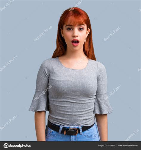 Young Redhead Girl Surprise Shocked Facial Expression Blue Background