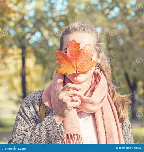 Beautiful Autumn Woman Holding Yellow Maple Leaf Romantic Girl In Fall