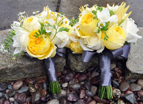 Bridesmaid And Bride Wedding Bouquets In Yellow White And Grey