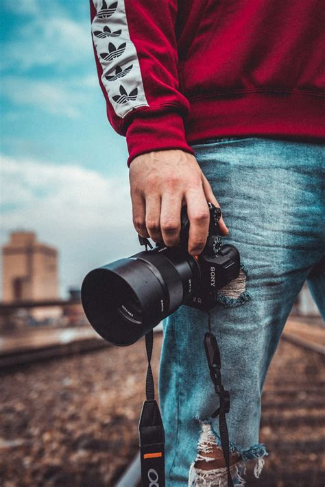 Boy With Hoodie And Camera Pictures Download Free Images On Unsplash