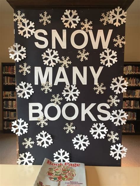 A Sign That Says Snow Many Books On The Side Of A Book Shelf In Front