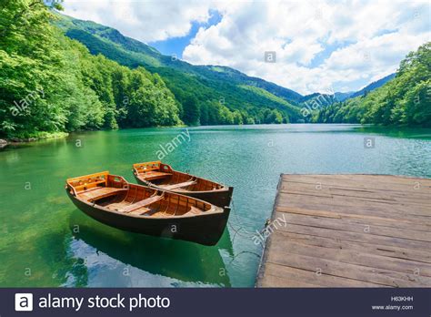 National park biogradska gora is located between the towns of mojkovac and kolasin, but it is closer to mojkovac. Pier and boats in Lake Biograd (Biogradsko jezero ...