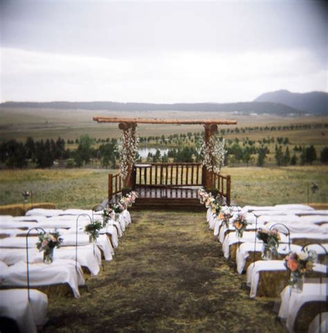 Pergola With Bales Of Hay For Guests To Sit On Rustic Wedding Reception