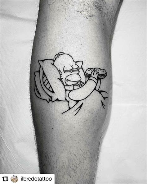 A Man S Leg With A Cartoon Character Tattoo On It