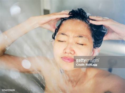 asian women take a shower photos and premium high res pictures getty images