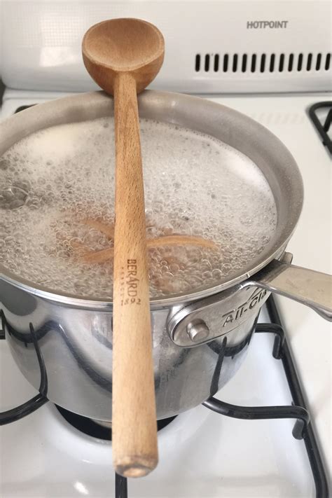 Place A Wooden Spoon Over The Top Of The Pot To Prevent
