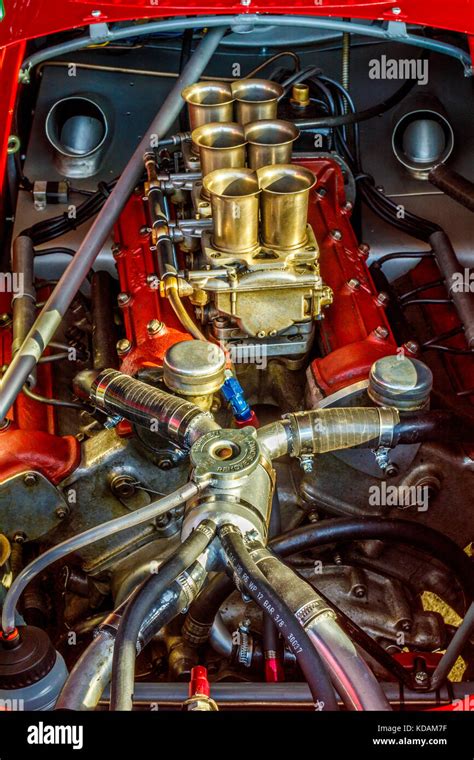 The Engine Powerplant Of The 1960 Ferrari 246 Dino In The Paddock