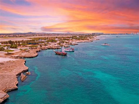Aerial From Aruba With Palm Beach In The Caribbean Sea At Sunset Stock