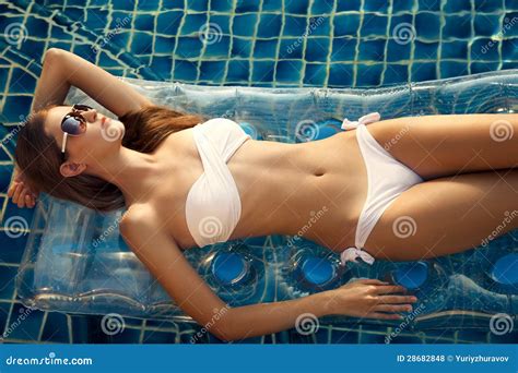 Beautiful Woman Sunbathing In Swimming Pool Stock Photo Image