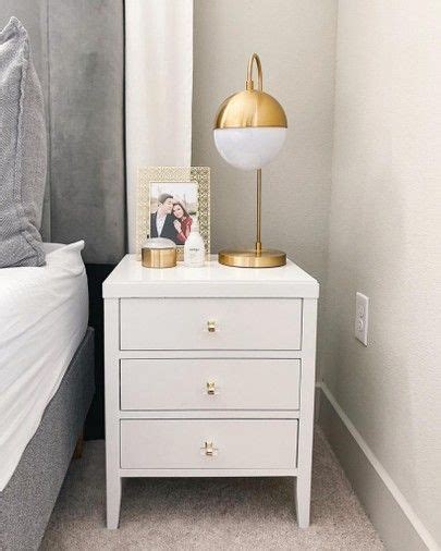 This makes a table clock or lighting option such as a table lamp easily accessible even while standing. Chic White Nightstand in 2020 | White and gold nightstand ...