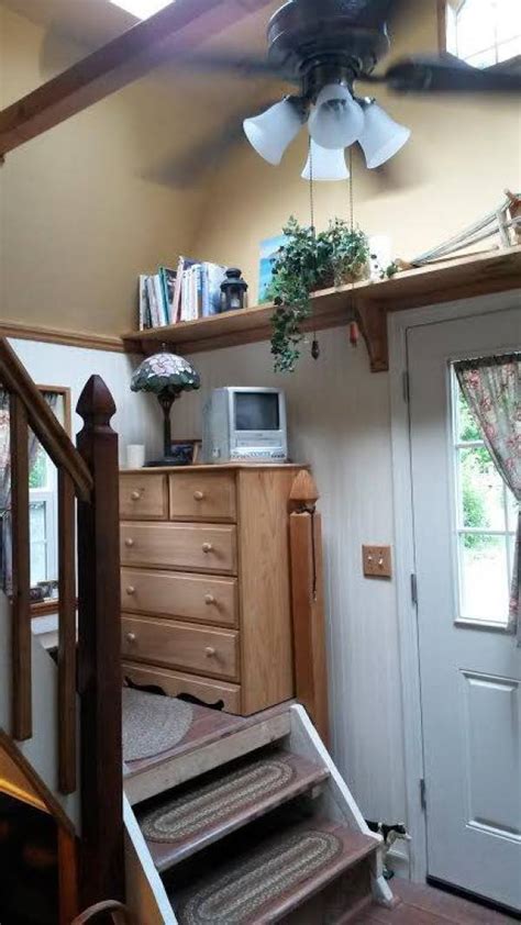 Steps leading to the left bedroom and the space below the workstation offer ample storage area and a small bathroom with white fixtures completes a beautiful. Woman Converts Barn Shed into 192 Sq. Ft. Tiny Home