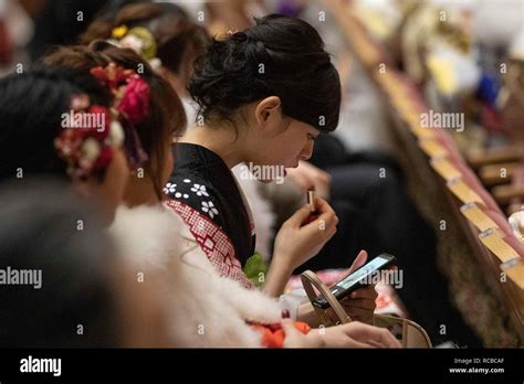 japanese girls dressed in colorful kimonos attend the coming of age day celebration ceremony at