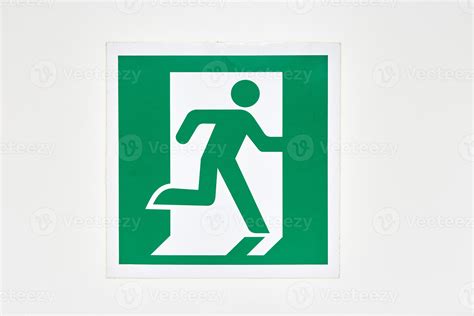 The Sign Of The Direction To The Evacuation Exit On The Wall In The