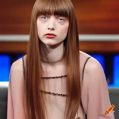 mia goth getting her bangs trimmed on a talk show
