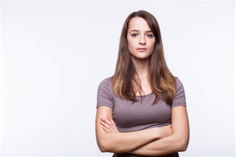 Serious Young Woman With Arms Crossed Stock Photo Download Image Now