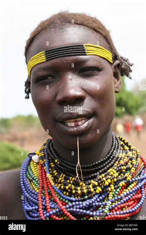 Africa Ethiopia Omo Valley Daasanach Tribe Woman In Front Of Hut Stock