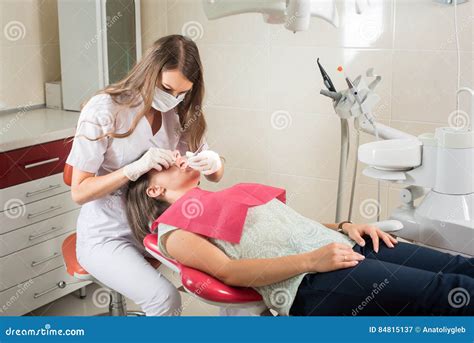 Woman Dentist In Her Office Treating Female Patient Stock Image Image