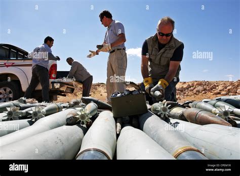 International Bomb Disposal Members Prepare Demolition Of Unexploded