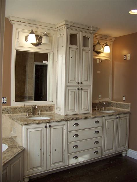A Large Bathroom With Two Sinks And Cabinets In It S Center Area Along