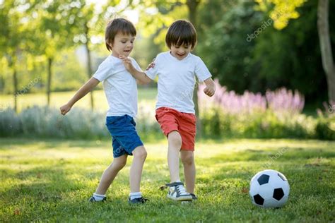 Two Cute Little Kids Playing Football Together Summertime Chi Stock