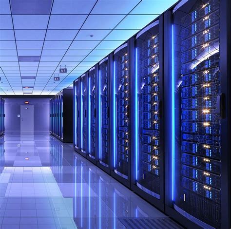 Rows Of Servers In A Data Center With Blue Lights On The Ceiling And