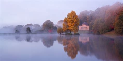 A Pre Dawn Glow Lights Up Stourhead Gardens In Wiltshire Reflection