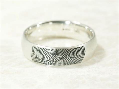 Se popularizou e ficou muito bom aqui representado. brent&jess custom handmade fingerprint wedding rings | Fingerprint jewelry, Fingerprint wedding ...