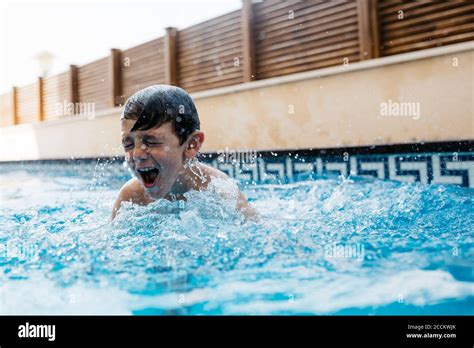 Boy Playing In Swimming Pool Hi Res Stock Photography And Images Alamy