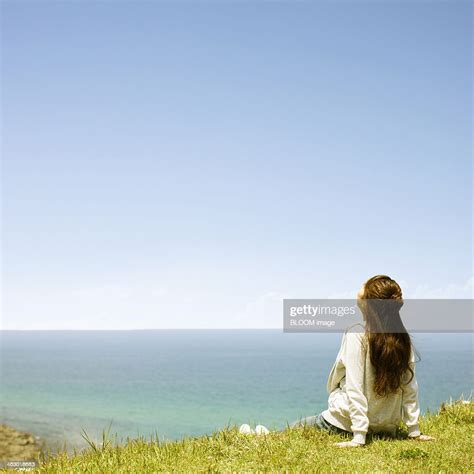 Woman Looking Towards The Sky High Res Stock Photo Getty Images