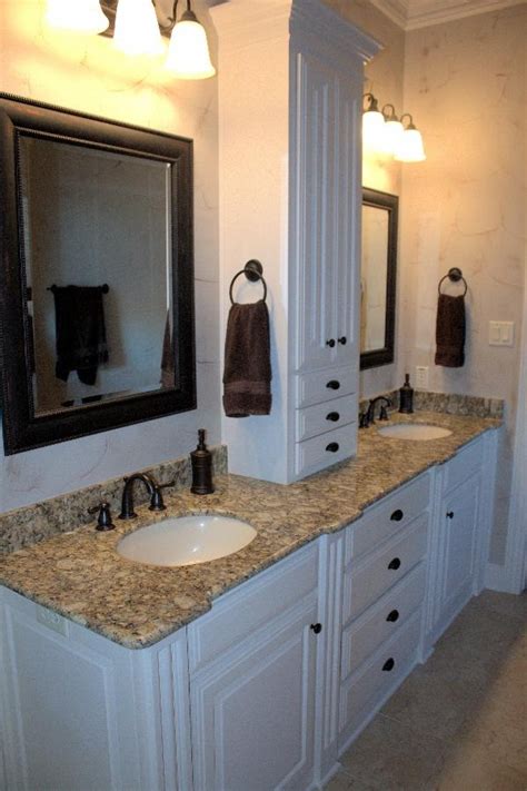 The most common double vanity with sinks material is metal. Master Bath - side-by-side vanity with center storage ...