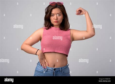 Asian Woman Flexing Biceps Hi Res Stock Photography And Images Alamy